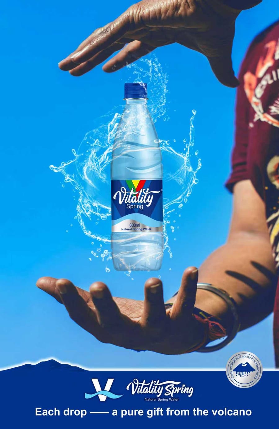 Hands holding a 600ml bottle of Vitality Spring — each drop a pure gift from the volcano